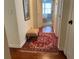 Bright hallway with hardwood floors, a rug, and a small bench at 1814 Tristan Se Dr, Smyrna, GA 30080