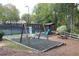 Community playground with swings, playhouse, and picnic table at 1814 Tristan Se Dr, Smyrna, GA 30080