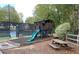 Playhouse and slide with nearby tennis courts at 1814 Tristan Se Dr, Smyrna, GA 30080