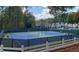 Two lighted tennis courts with surrounding fencing at 1814 Tristan Se Dr, Smyrna, GA 30080