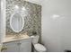 White vanity, oval mirror, and mosaic tile at 729 Cedar Pointe Sw Ct, Marietta, GA 30008