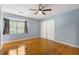 Bedroom with hardwood floors, ceiling fan and large closet at 729 Cedar Pointe Sw Ct, Marietta, GA 30008