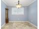 Light blue dining room with tiled floor at 729 Cedar Pointe Sw Ct, Marietta, GA 30008