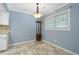 Light blue dining room with tiled floor at 729 Cedar Pointe Sw Ct, Marietta, GA 30008