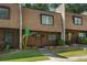 Brown townhome with landscaping and a walkway at 729 Cedar Pointe Sw Ct, Marietta, GA 30008