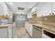 Bright kitchen with white cabinets, tile flooring, and granite countertops at 729 Cedar Pointe Sw Ct, Marietta, GA 30008