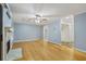 Living area with hardwood floors, fireplace and view of kitchen at 729 Cedar Pointe Sw Ct, Marietta, GA 30008