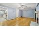 Hardwood floor living room with view into kitchen and access to other rooms at 729 Cedar Pointe Sw Ct, Marietta, GA 30008