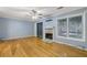 Living room features hardwood floors, fireplace, and sliding glass doors at 729 Cedar Pointe Sw Ct, Marietta, GA 30008