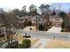 Aerial view of residential neighborhood with tree-lined street at 2455 Ellijay Ne Dr, Brookhaven, GA 30319