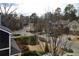 View of a tree-lined residential street from a house window at 2455 Ellijay Ne Dr, Brookhaven, GA 30319