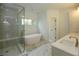 Spa-like bathroom with soaking tub and walk-in shower at 2455 Ellijay Ne Dr, Brookhaven, GA 30319