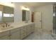 Elegant bathroom with double vanity and marble flooring at 2455 Ellijay Ne Dr, Brookhaven, GA 30319