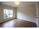 Bright bedroom with hardwood floors and large windows at 2455 Ellijay Ne Dr, Brookhaven, GA 30319