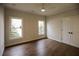 Bedroom with hardwood floors and double doors at 2455 Ellijay Ne Dr, Brookhaven, GA 30319