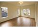 Bright bedroom with hardwood floors and multiple windows at 2455 Ellijay Ne Dr, Brookhaven, GA 30319