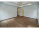 Bright bedroom with hardwood floors and a door to the bathroom at 2455 Ellijay Ne Dr, Brookhaven, GA 30319