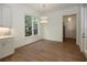 Bright breakfast nook with hardwood floors and built-in shelving at 2455 Ellijay Ne Dr, Brookhaven, GA 30319