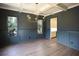 Formal dining room with coffered ceiling and hardwood floors at 2455 Ellijay Ne Dr, Brookhaven, GA 30319