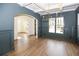 Formal dining room with coffered ceiling and hardwood floors at 2455 Ellijay Ne Dr, Brookhaven, GA 30319