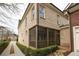 Home exterior with a screened porch and brick facade at 2455 Ellijay Ne Dr, Brookhaven, GA 30319