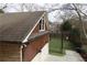 Detached garage with dormer window and artificial turf at 2455 Ellijay Ne Dr, Brookhaven, GA 30319