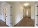 Bright hallway with hardwood floors and white doors at 2455 Ellijay Ne Dr, Brookhaven, GA 30319