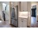 Stainless steel refrigerator and custom cabinetry in kitchen at 2455 Ellijay Ne Dr, Brookhaven, GA 30319