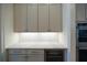 Modern kitchen countertop with white marble and built-in wine cooler at 2455 Ellijay Ne Dr, Brookhaven, GA 30319