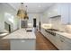 Spacious kitchen with marble countertops, stainless steel appliances, and hardwood floors at 2455 Ellijay Ne Dr, Brookhaven, GA 30319