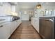 Hardwood floor kitchen with white cabinets and stainless steel appliances at 2455 Ellijay Ne Dr, Brookhaven, GA 30319