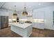 Modern kitchen featuring marble countertops and stainless steel appliances at 2455 Ellijay Ne Dr, Brookhaven, GA 30319