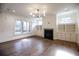 Spacious living room featuring hardwood floors, fireplace, and built-in shelving at 2455 Ellijay Ne Dr, Brookhaven, GA 30319