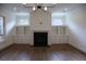 Bright living room with hardwood floors, fireplace, and built-in shelving at 2455 Ellijay Ne Dr, Brookhaven, GA 30319