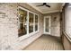 Screened porch with brick exterior and view of backyard at 2455 Ellijay Ne Dr, Brookhaven, GA 30319