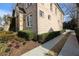 Brick home side view with landscaping and driveway at 2455 Ellijay Ne Dr, Brookhaven, GA 30319