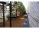 Side yard with gate, trees, and HVAC units at 2455 Ellijay Ne Dr, Brookhaven, GA 30319