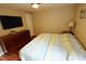 Main bedroom with a king-size bed and large dresser at 2850 Rhett Butler Dr, Douglasville, GA 30135