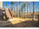 Expansive backyard features a staircase to a second story deck surrounded by natural landscape at 337 Ellis Preserve Sw Ln, Marietta, GA 30064