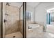 Bathroom showcasing walk-in shower, soaking tub, and views to the carpeted bedroom at 337 Ellis Preserve Sw Ln, Marietta, GA 30064