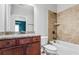 Bathroom featuring granite countertop, wood cabinets, tile flooring, and shower/tub combo at 337 Ellis Preserve Sw Ln, Marietta, GA 30064