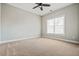 Bright bedroom with neutral carpet, ceiling fan, and natural light at 337 Ellis Preserve Sw Ln, Marietta, GA 30064