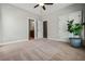 Bedroom featuring neutral colored walls and carpeting, with three entryways and one plant at 337 Ellis Preserve Sw Ln, Marietta, GA 30064