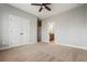 Bedroom with neutral carpet, ceiling fan, and walk-in closet at 337 Ellis Preserve Sw Ln, Marietta, GA 30064