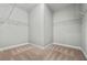 An empty walk-in closet with wire shelving and neutral carpeting at 337 Ellis Preserve Sw Ln, Marietta, GA 30064