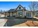 Attractive clubhouse with stone and siding exterior, inviting front porch, and well-manicured lawn at 337 Ellis Preserve Sw Ln, Marietta, GA 30064