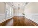 Elegant dining room featuring hardwood floors, plantation shutters, and decorative lighting at 337 Ellis Preserve Sw Ln, Marietta, GA 30064