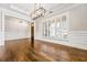 Dining area with hardwood floors, plantation shutters, decorative lights and trimwork at 337 Ellis Preserve Sw Ln, Marietta, GA 30064