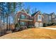 Brick home on a hill, featuring a well-maintained lawn, a covered porch, and a two-car garage at 337 Ellis Preserve Sw Ln, Marietta, GA 30064