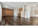 Spacious living room with hardwood floors and brick accent wall at 337 Ellis Preserve Sw Ln, Marietta, GA 30064